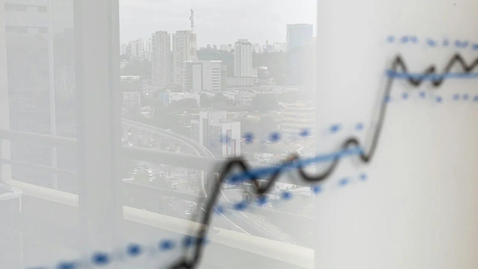 A rising line graph drawn on a glass board
