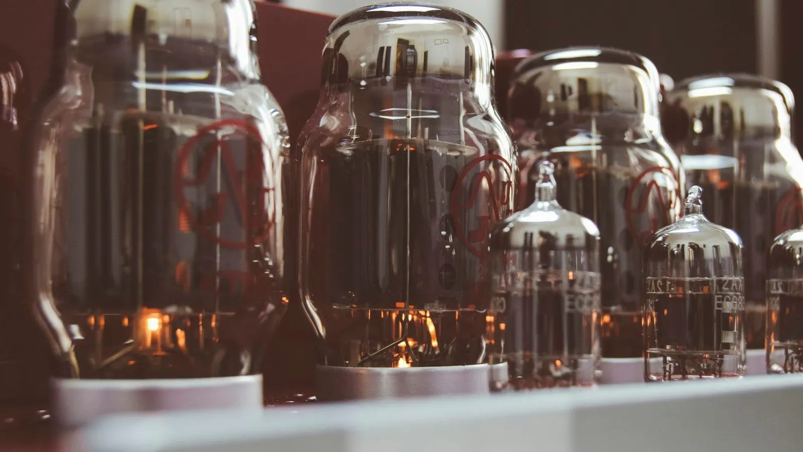 A row of old glass vacuum tubes