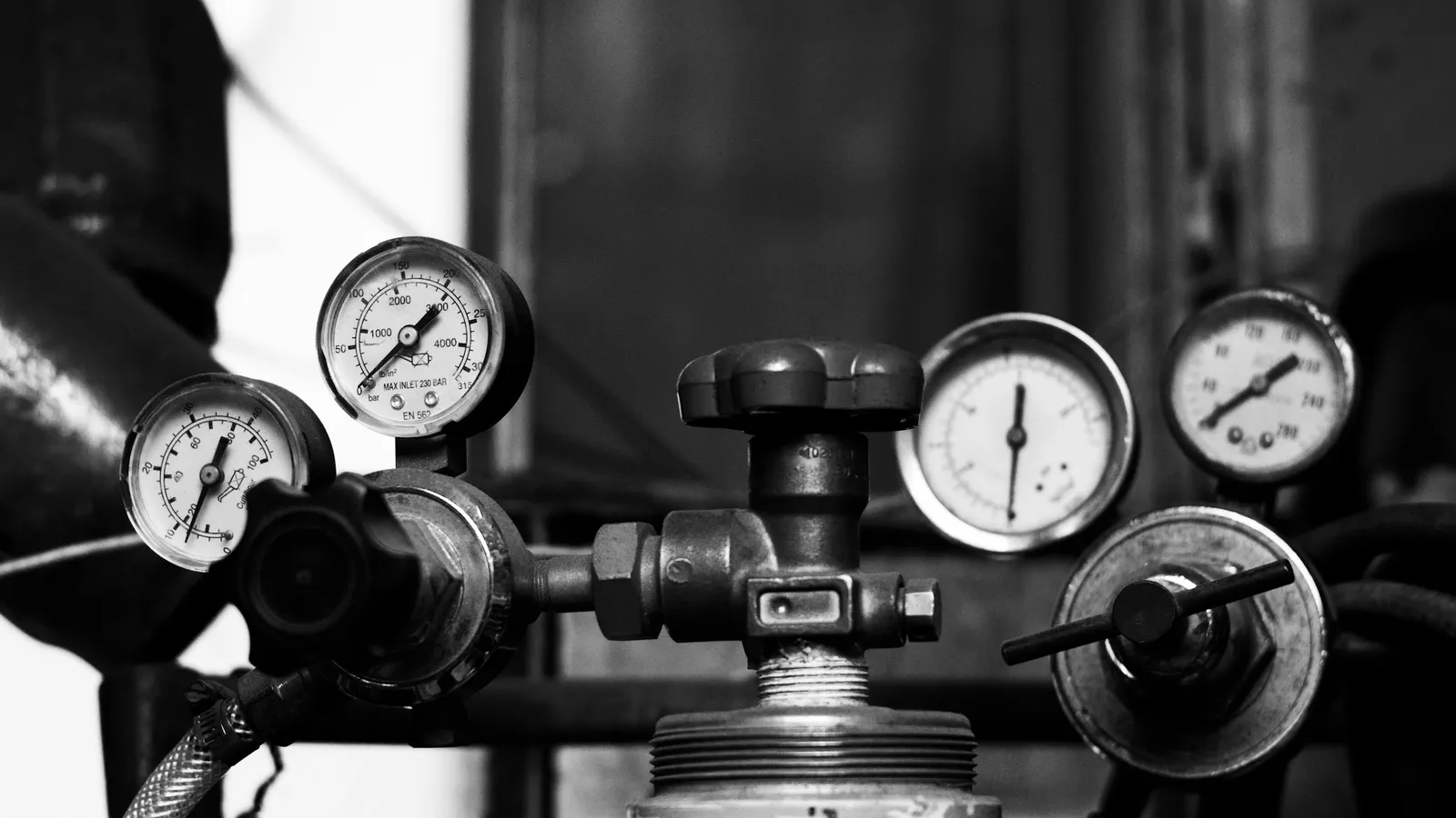 A row of pressure gauges on old machinery