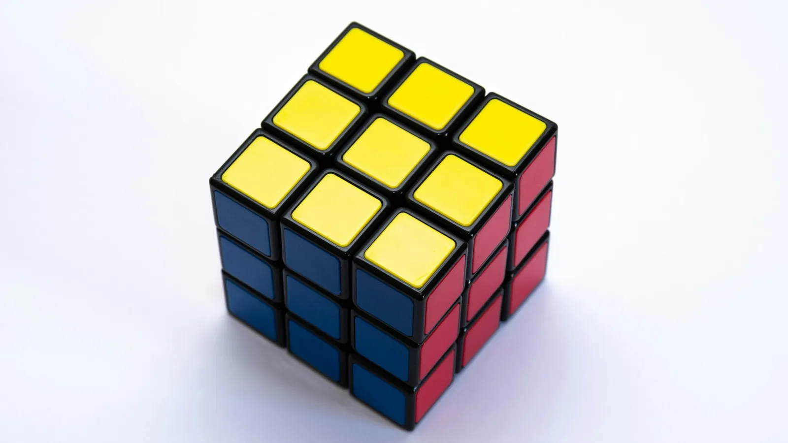 A Rubik cube on a white surface