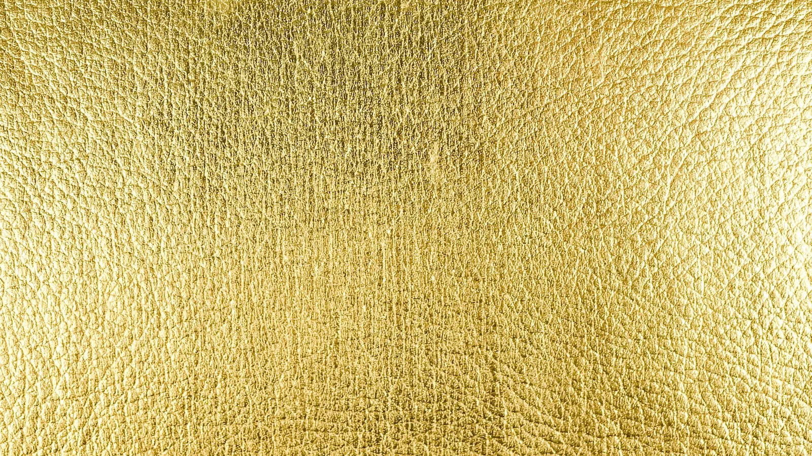 A sheet of thin gold leaf with a crinkled texture