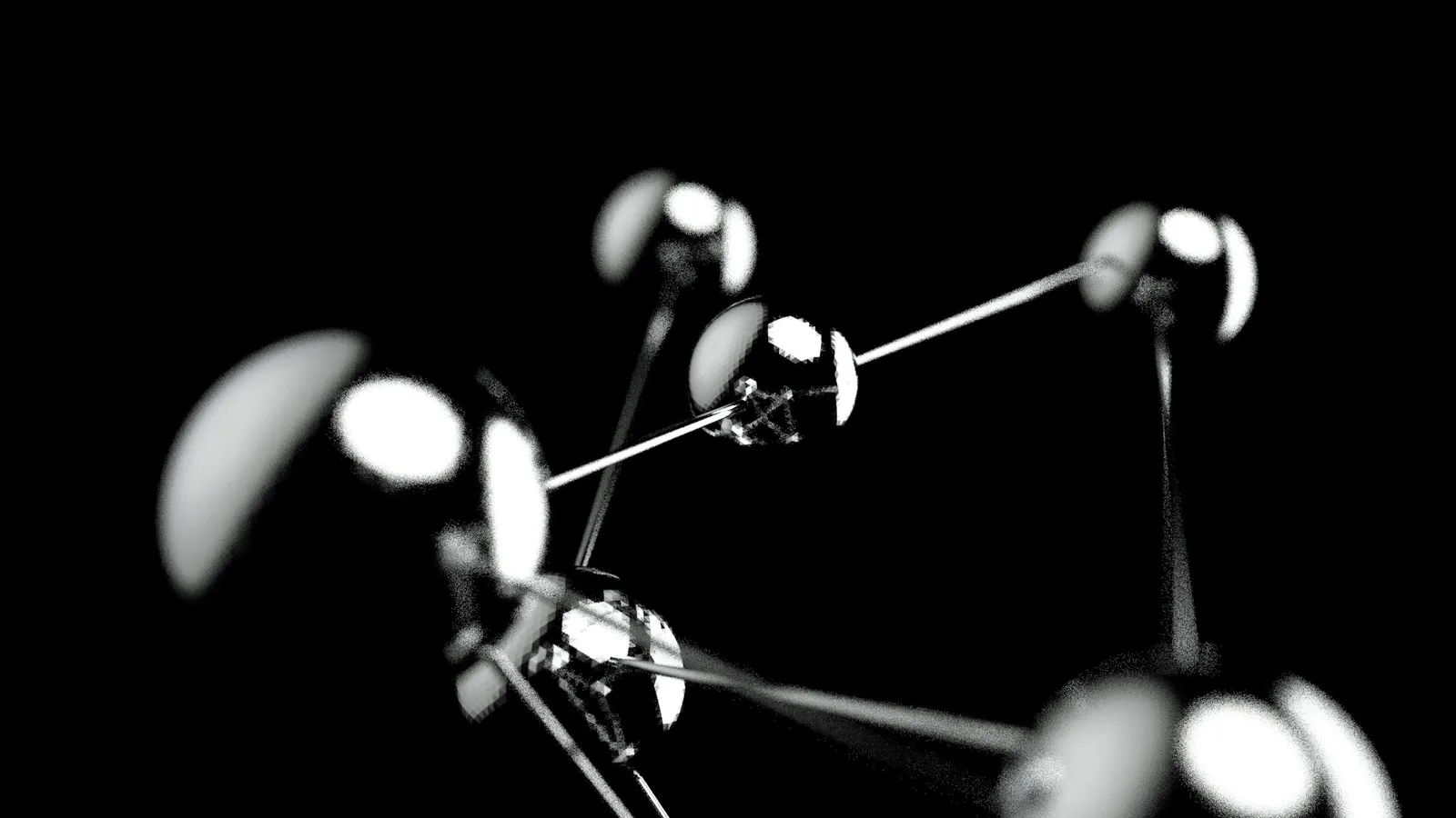 A shiny ball-and-stick molecular model against a black background