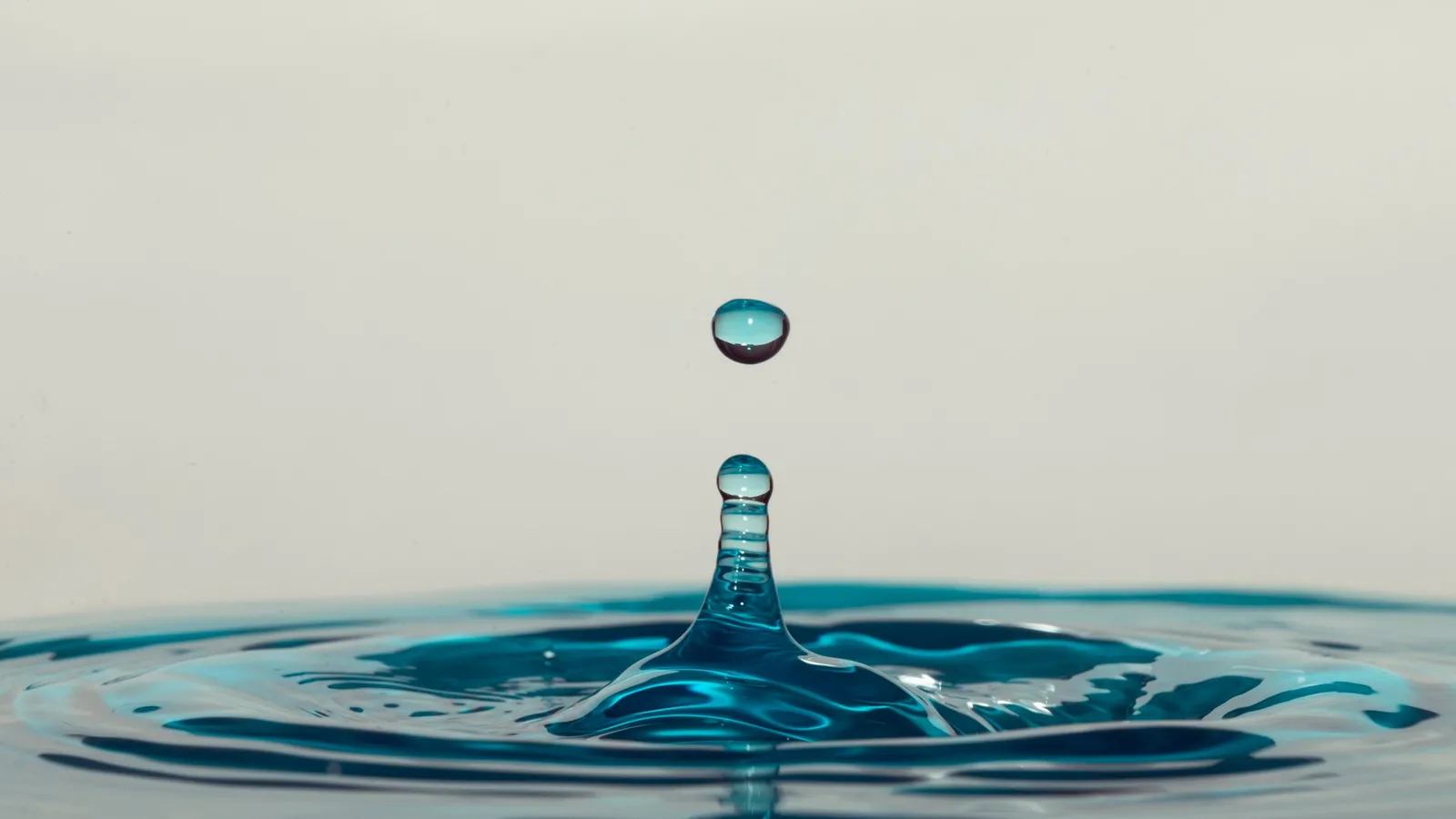A single drop falling into still water