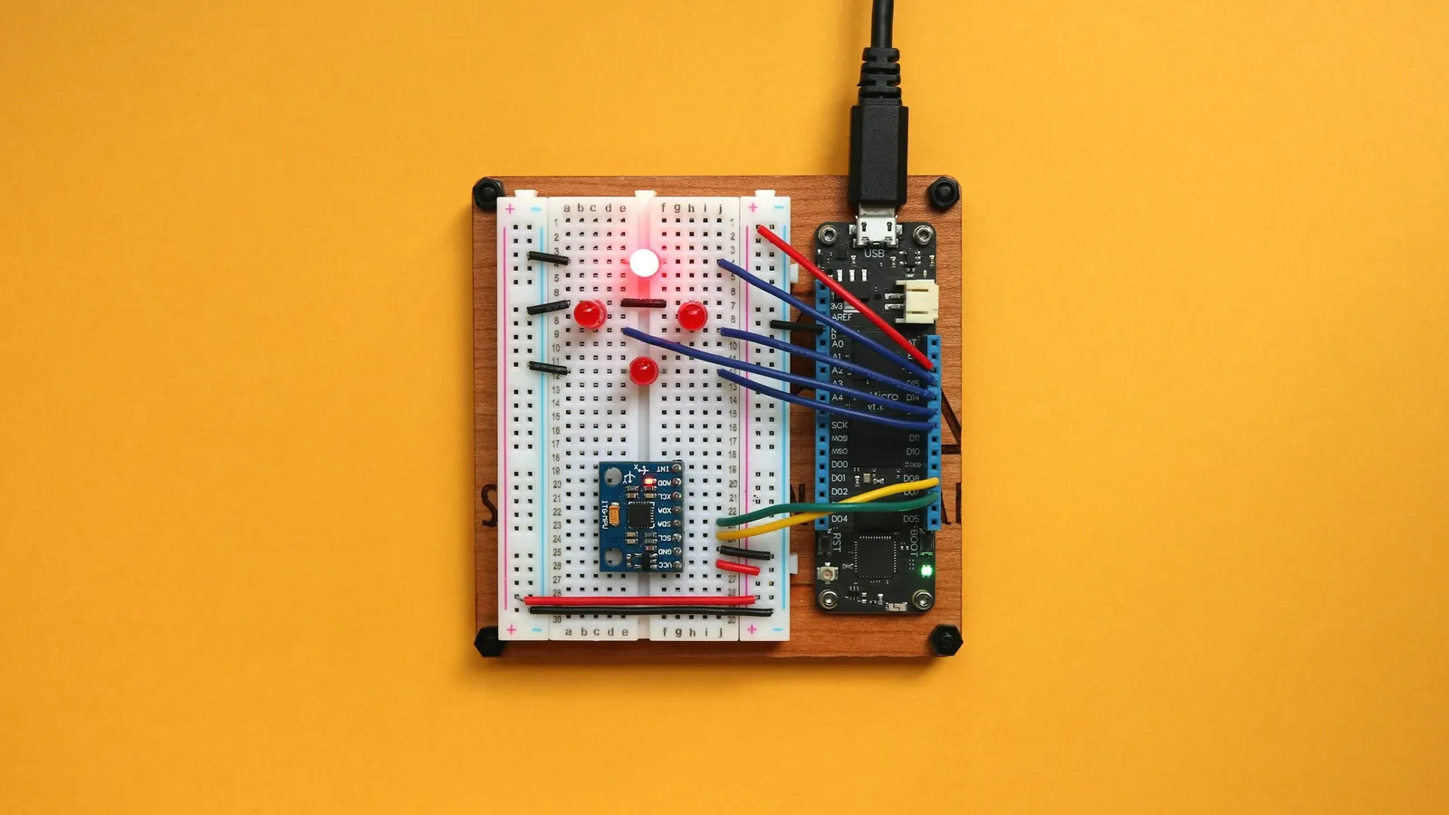 A small breadboard circuit with LEDs and wires