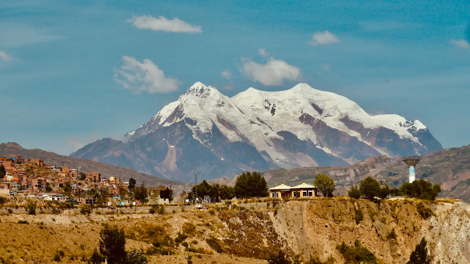 A snow-capped Andean mountain above a dry plain