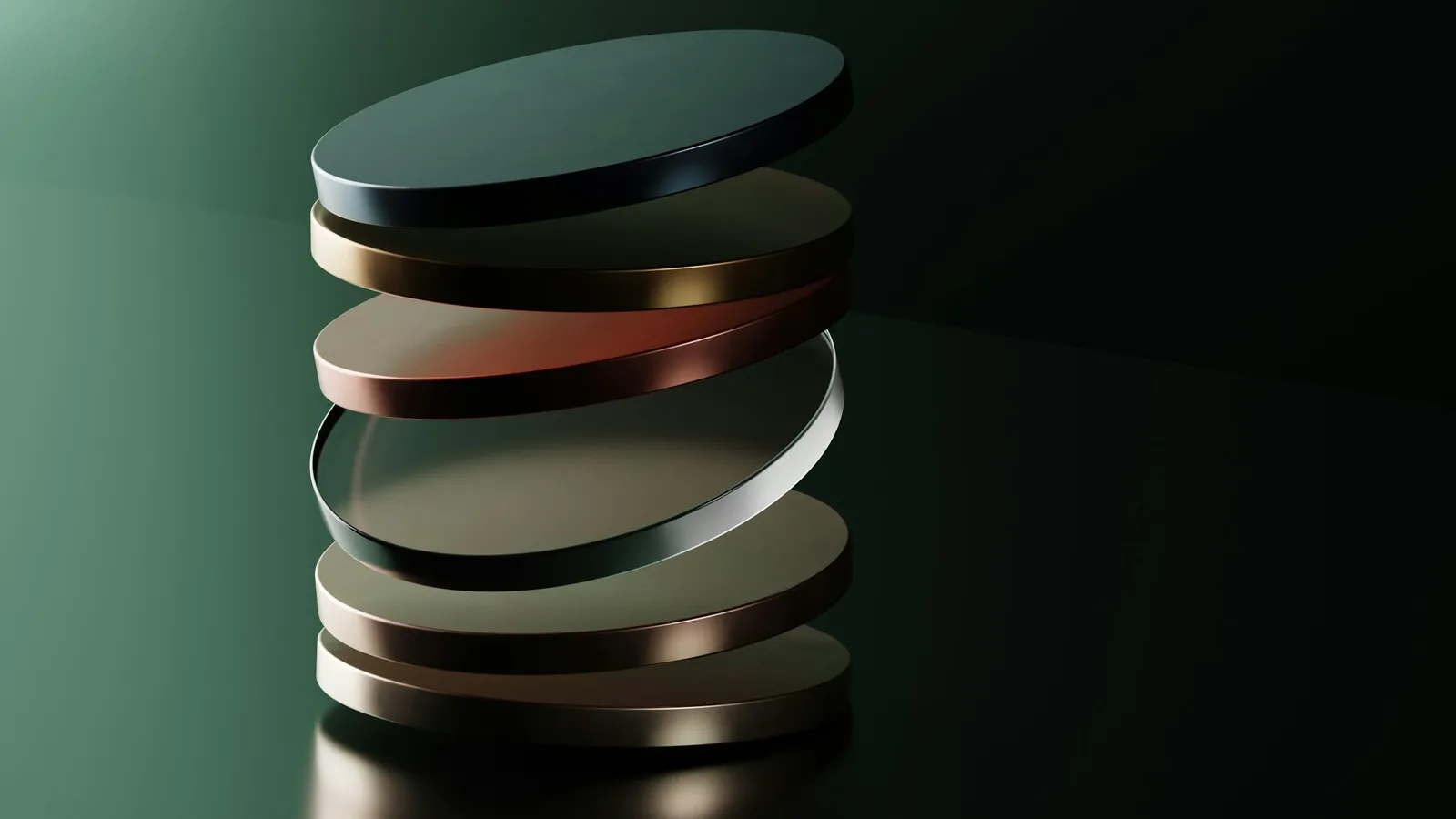 A stack of alternating metal discs against a dark green background