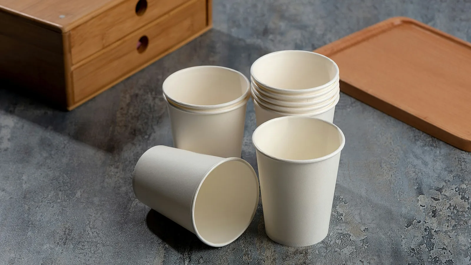 A stack of plain paper cups on a table