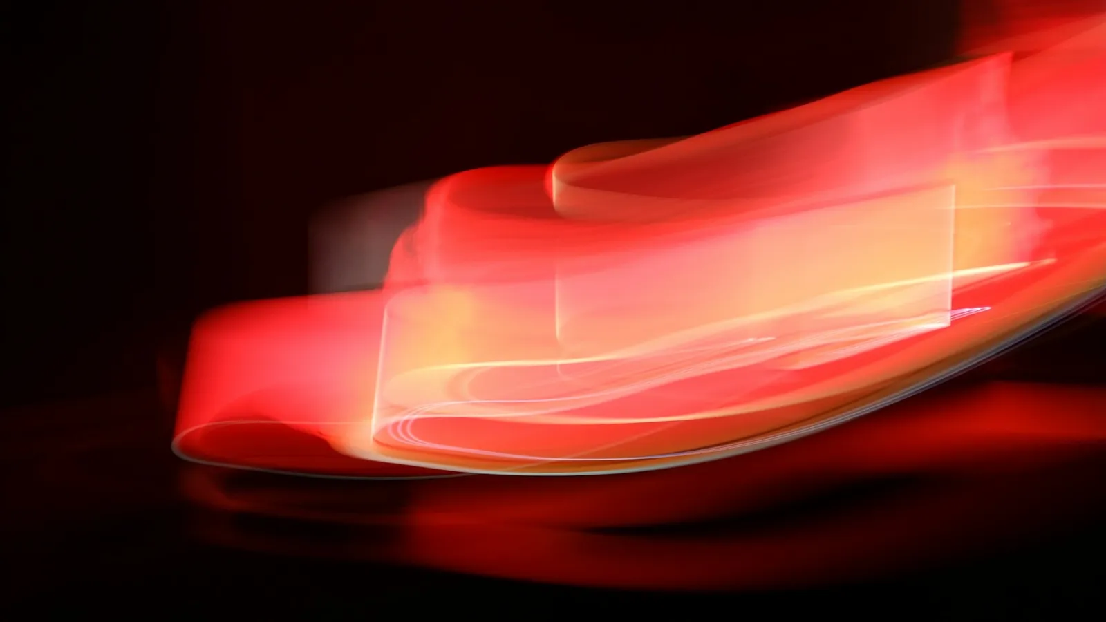 A streak of red and white light in the dark