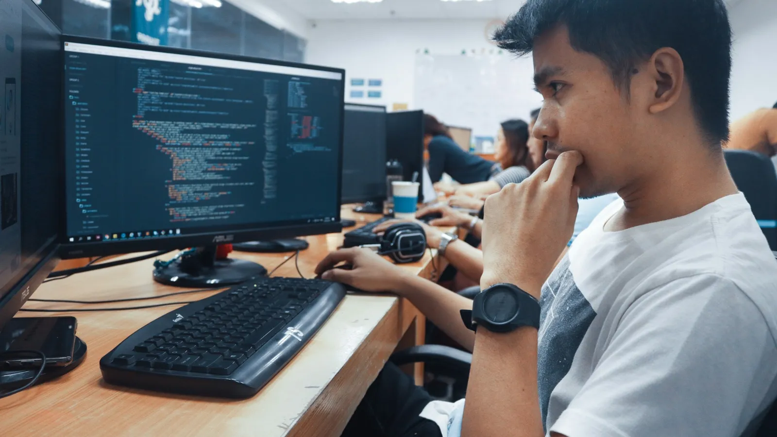 A student working at a computer in a lab