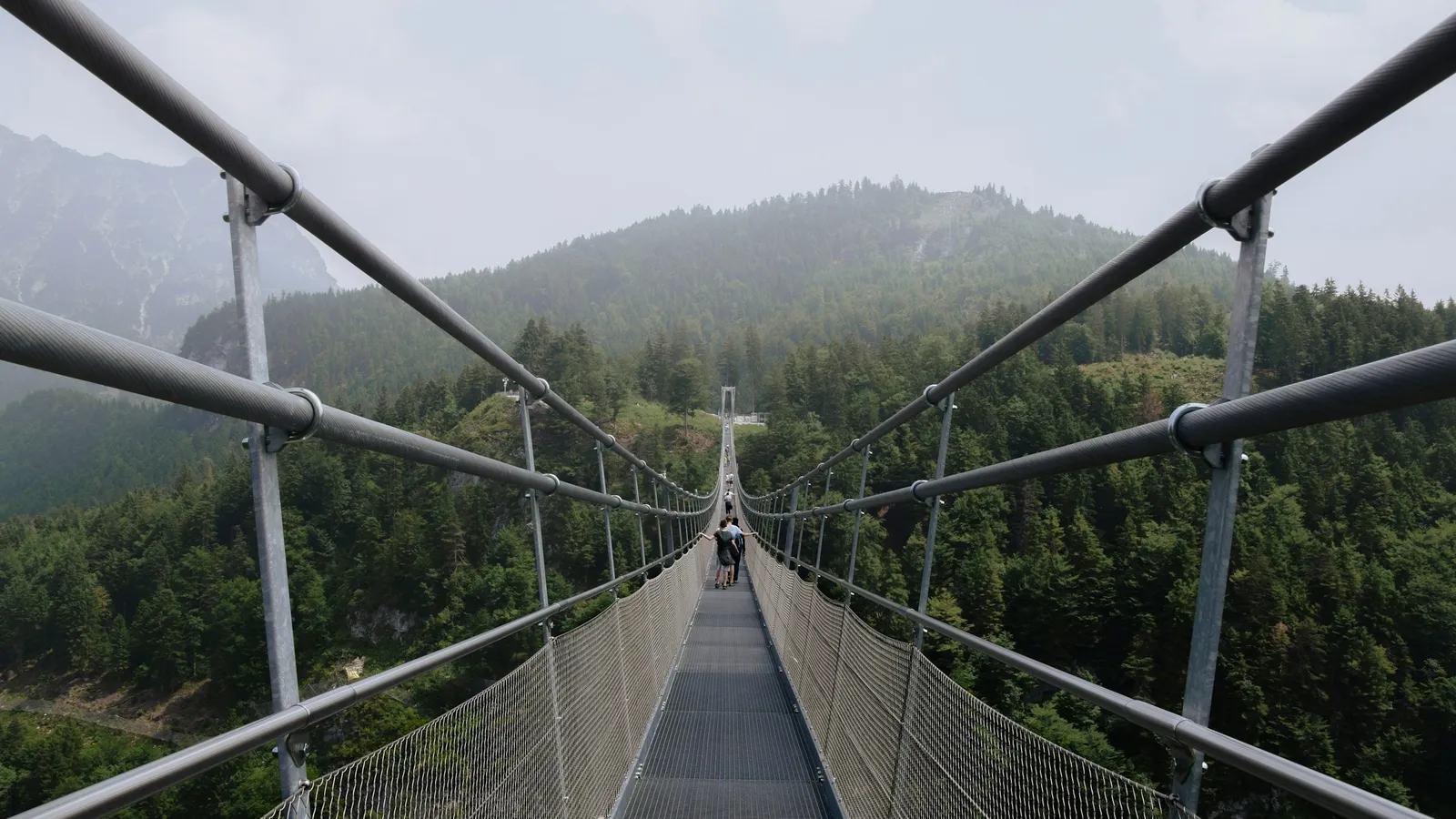 A suspension footbridge held by steel cables