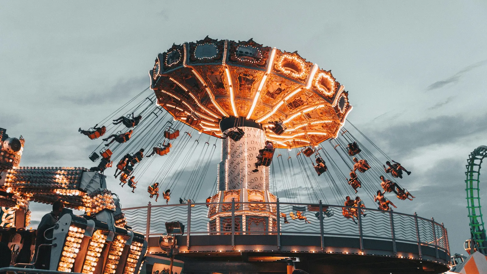 A swing carousel spinning with riders swung outwards