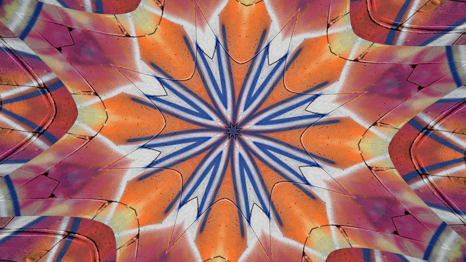 A symmetrical kaleidoscope pattern in orange, blue and pink