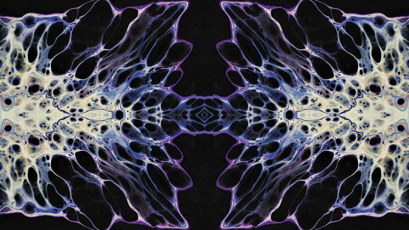A symmetrical lace-like pattern of light on black