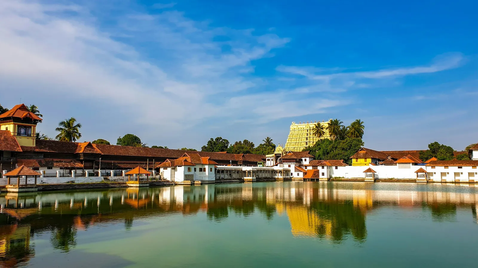 A temple pond in Kerala reflecting the sky