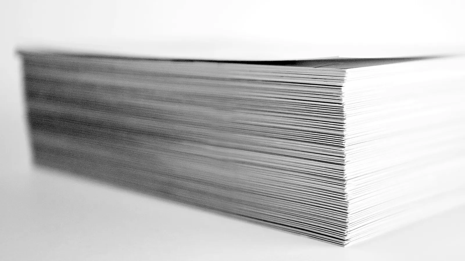 A thick stack of white paper sheets