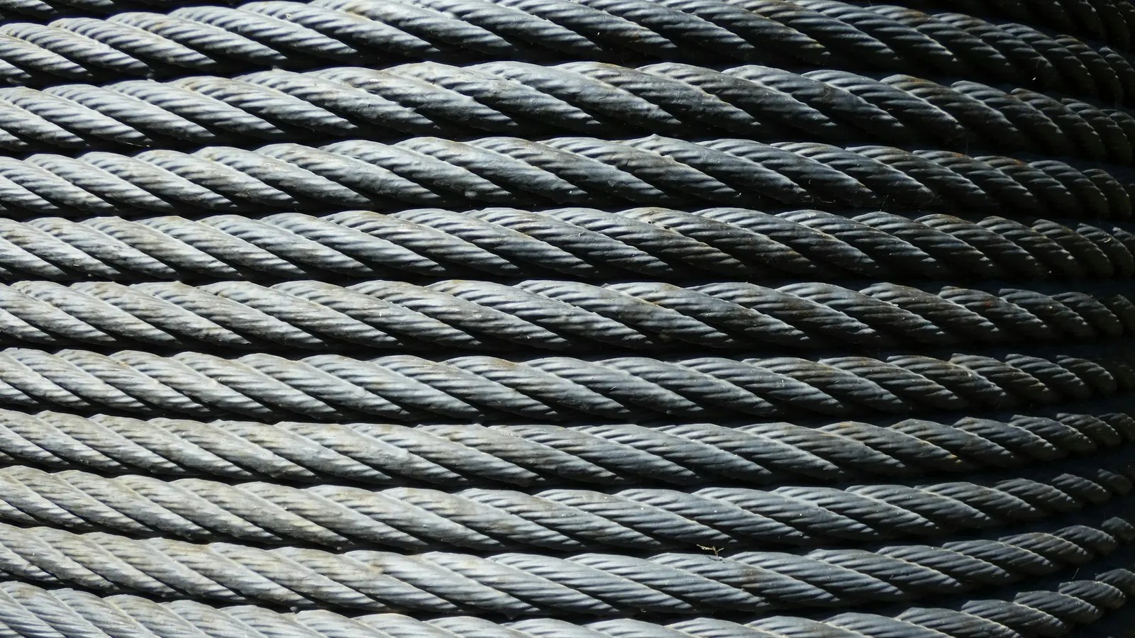 A tightly wound coil of steel wire rope