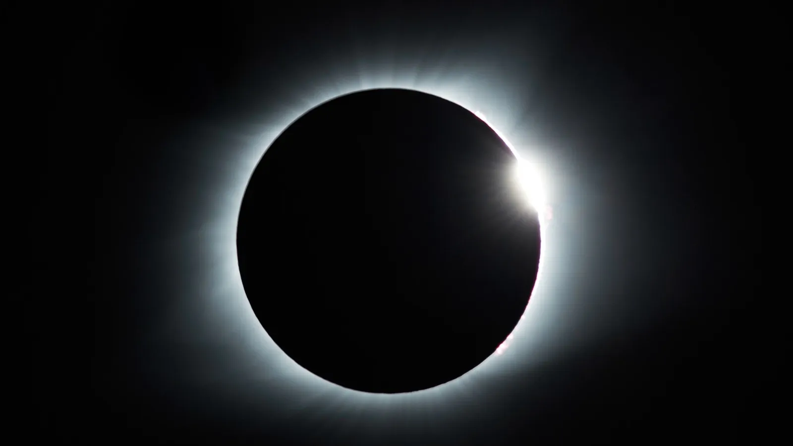 A total solar eclipse with the bright corona around the Moon