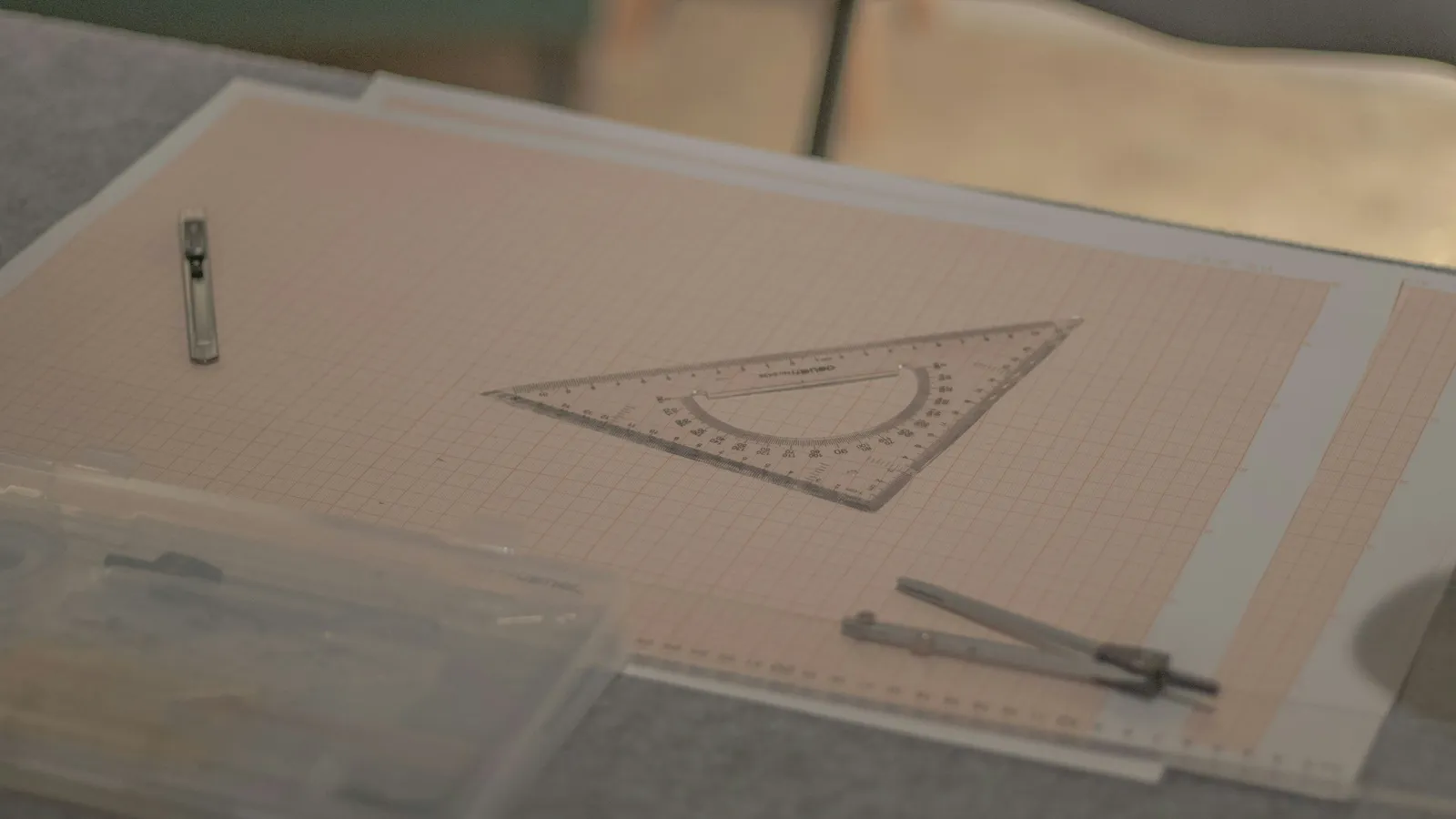 A triangle drawn with a set square on drafting paper