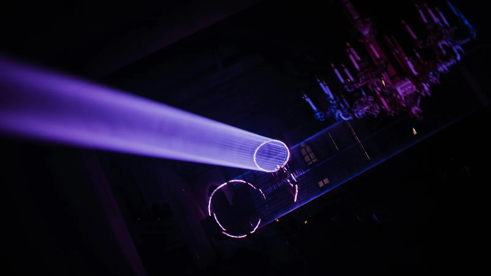 A violet beam of light glowing in the dark