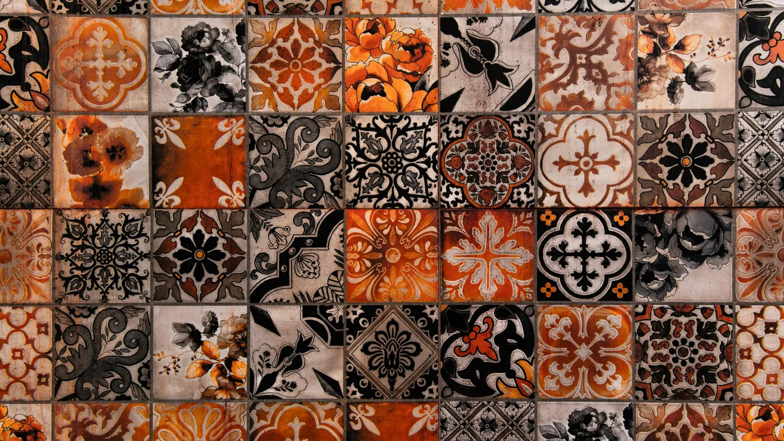A wall of repeating patterned tiles