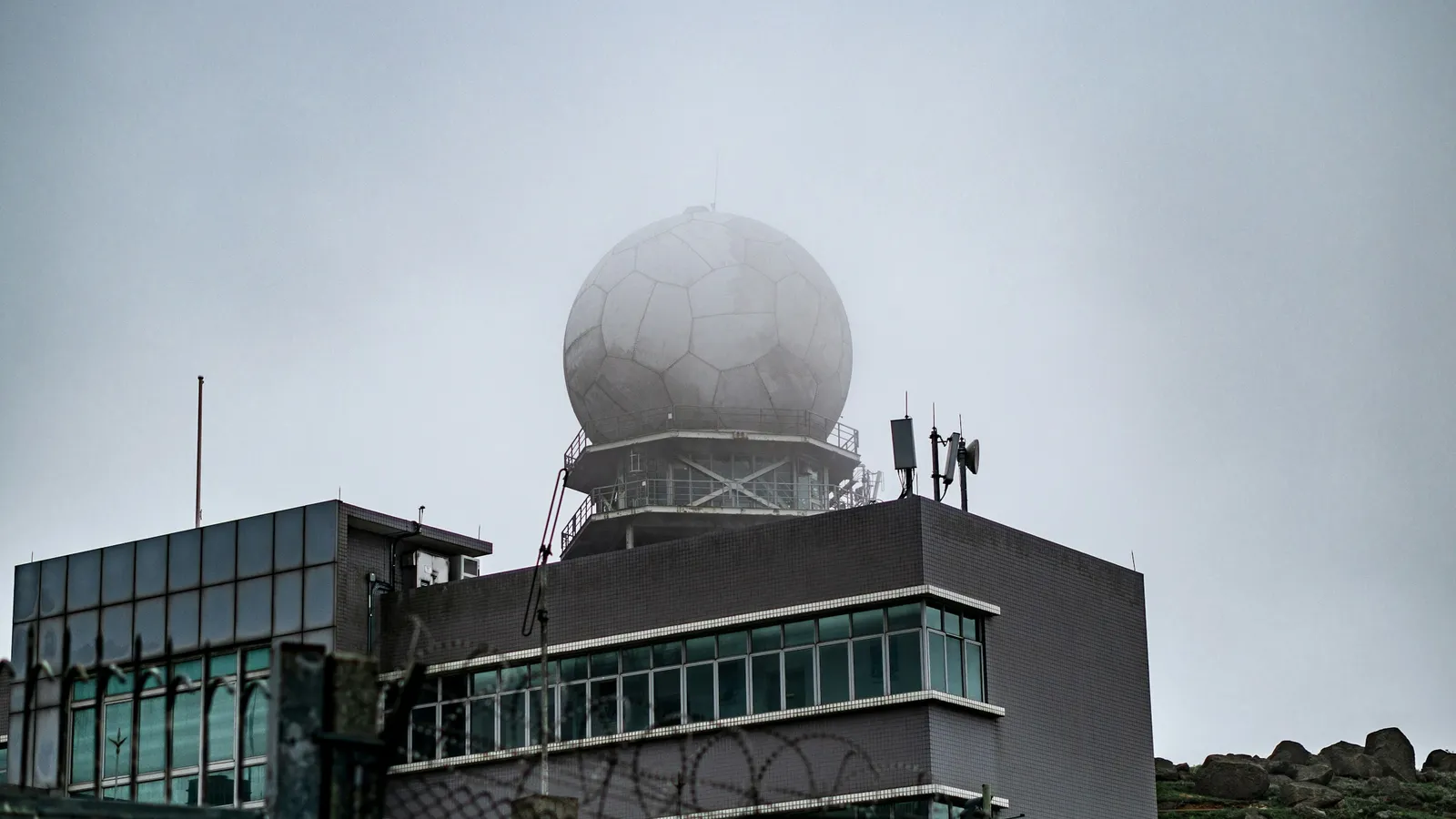 A weather radar dome on top of a building