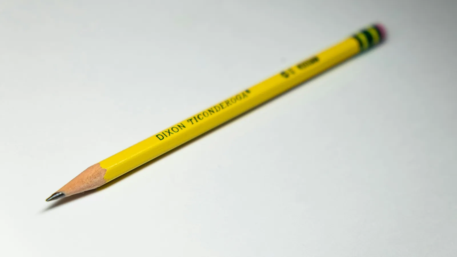 A yellow pencil on a white background