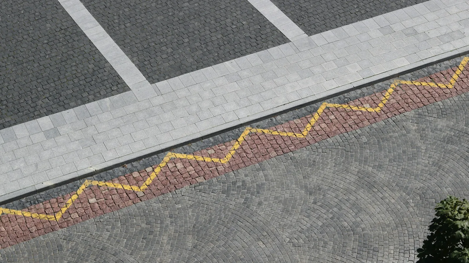 A zigzag painted line along a pavement