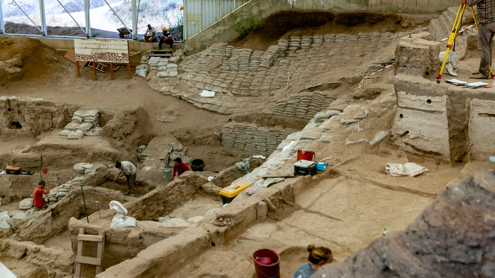 An archaeological excavation site with exposed layers