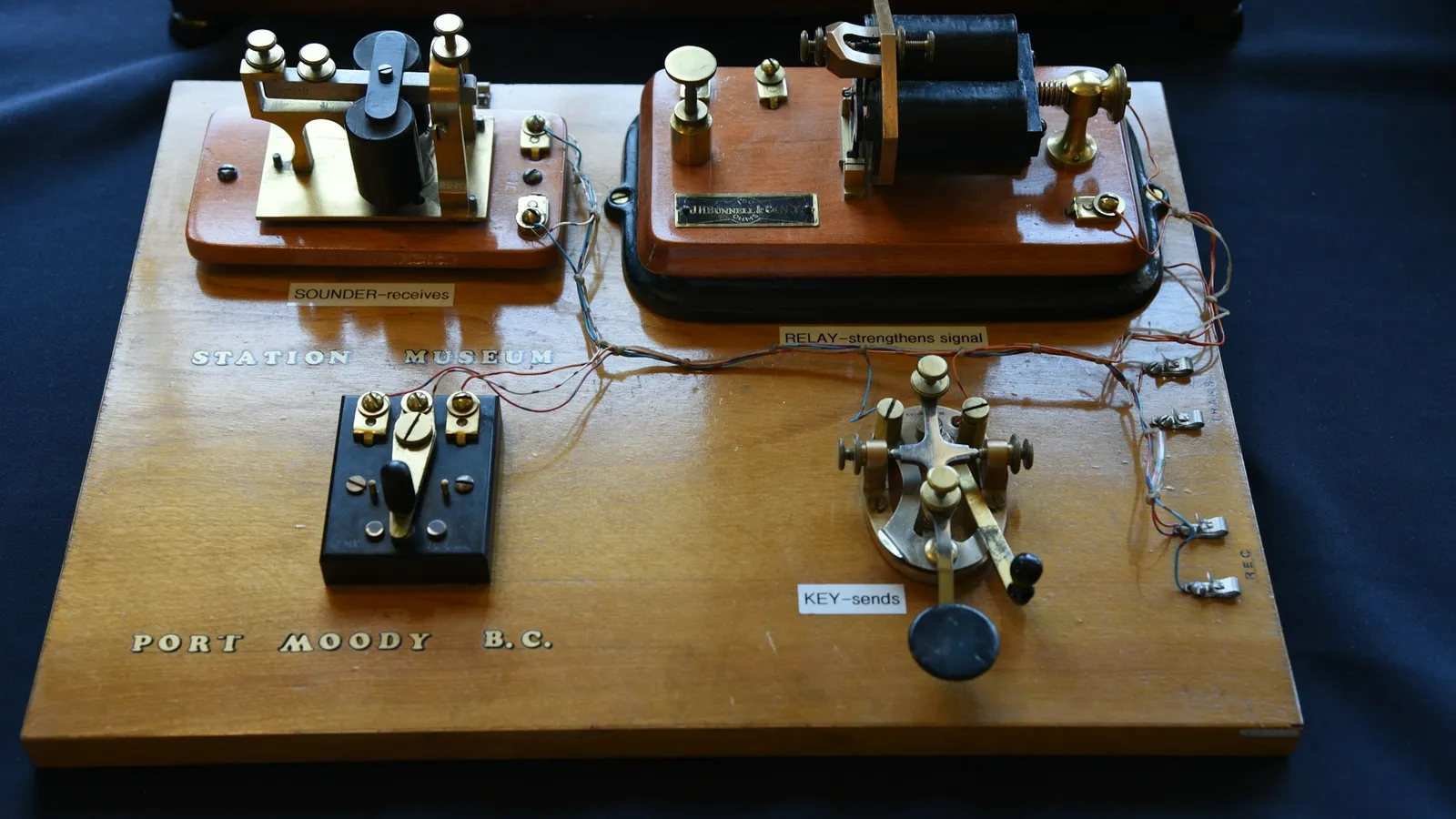 An early telegraph transmitter on a wooden base