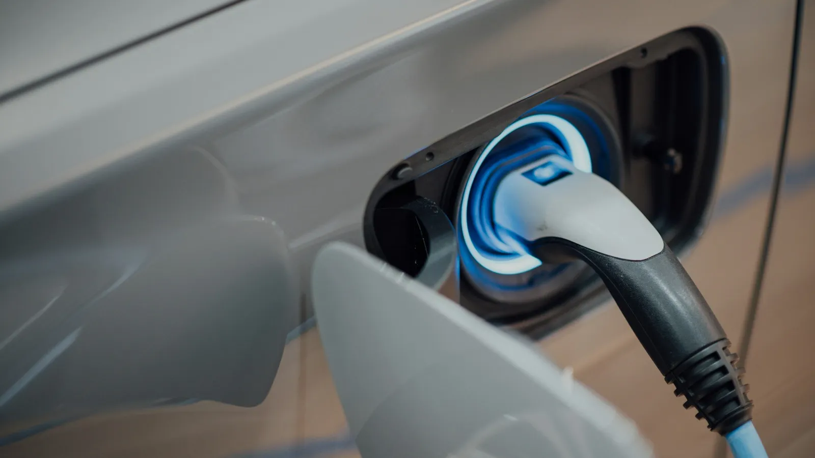 An electric car plugged in to charge