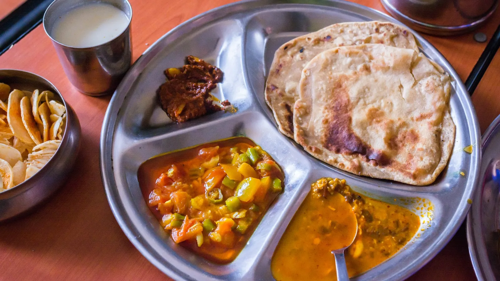 An Indian thali with dal, vegetables and roti