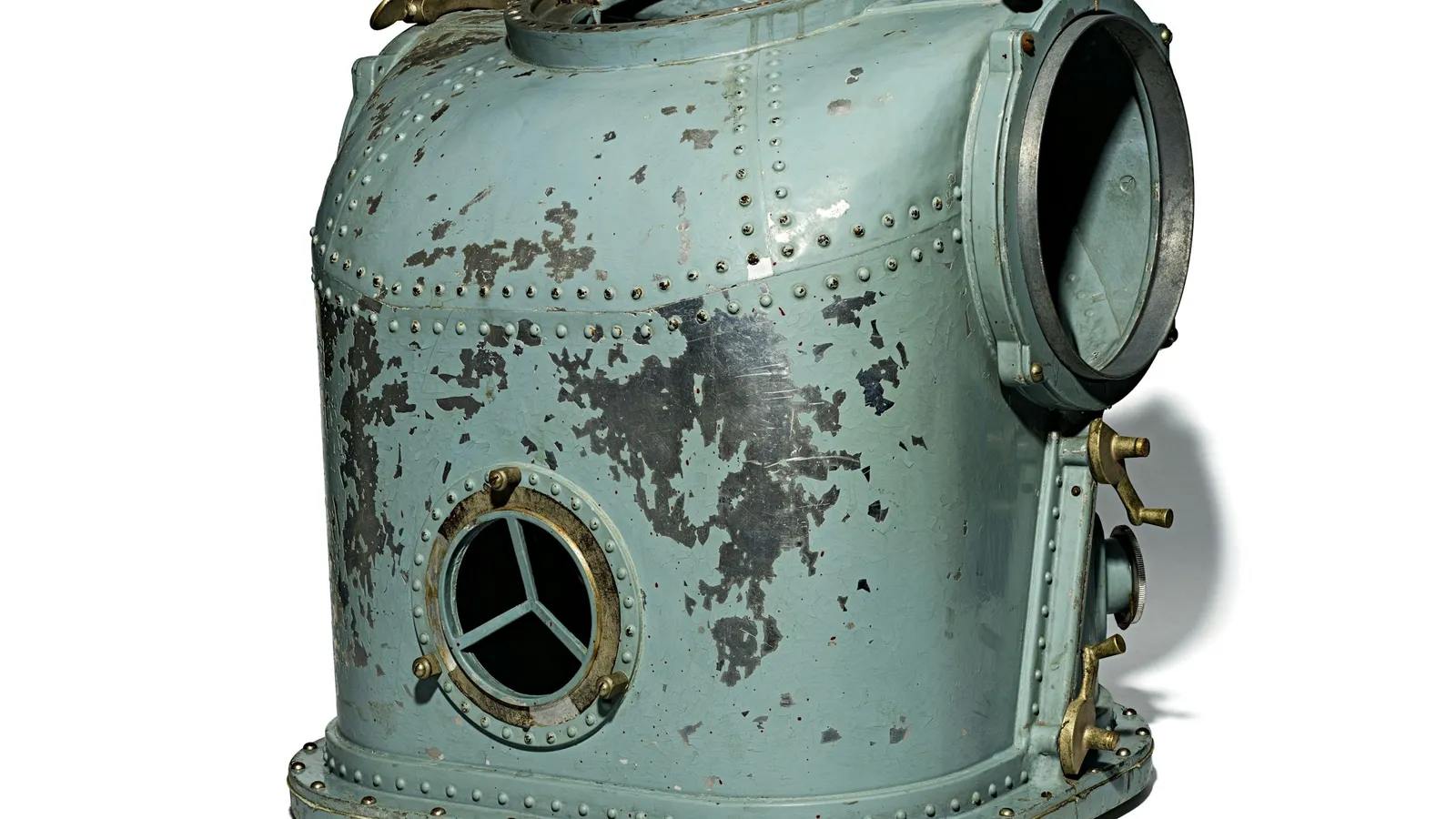 An old diving helmet on white