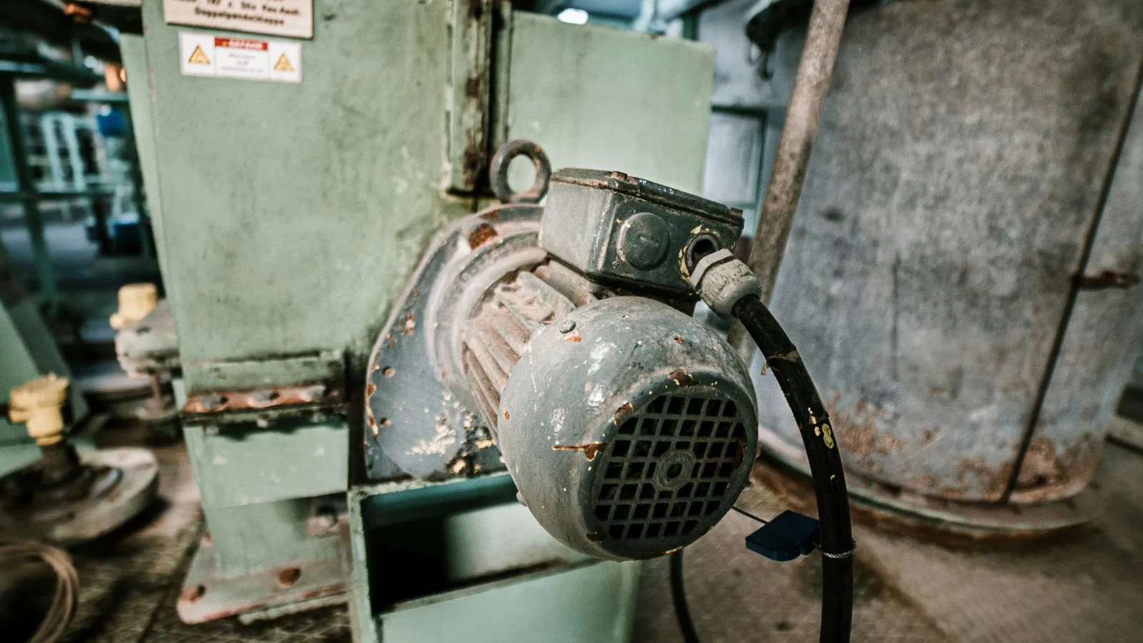 An old electric motor in an industrial room
