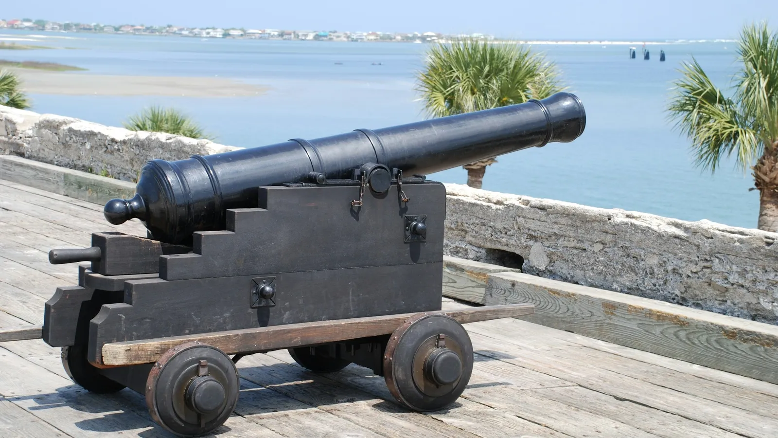 An old iron cannon on a wooden carriage