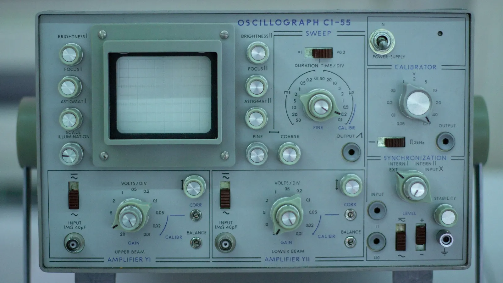 An old oscilloscope with dials and a screen
