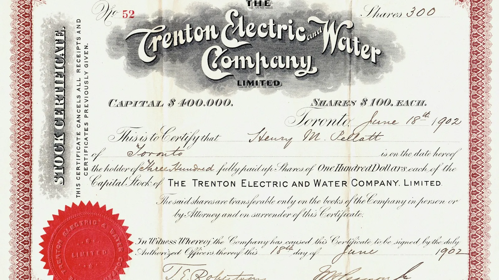 An old printed share certificate with a red seal