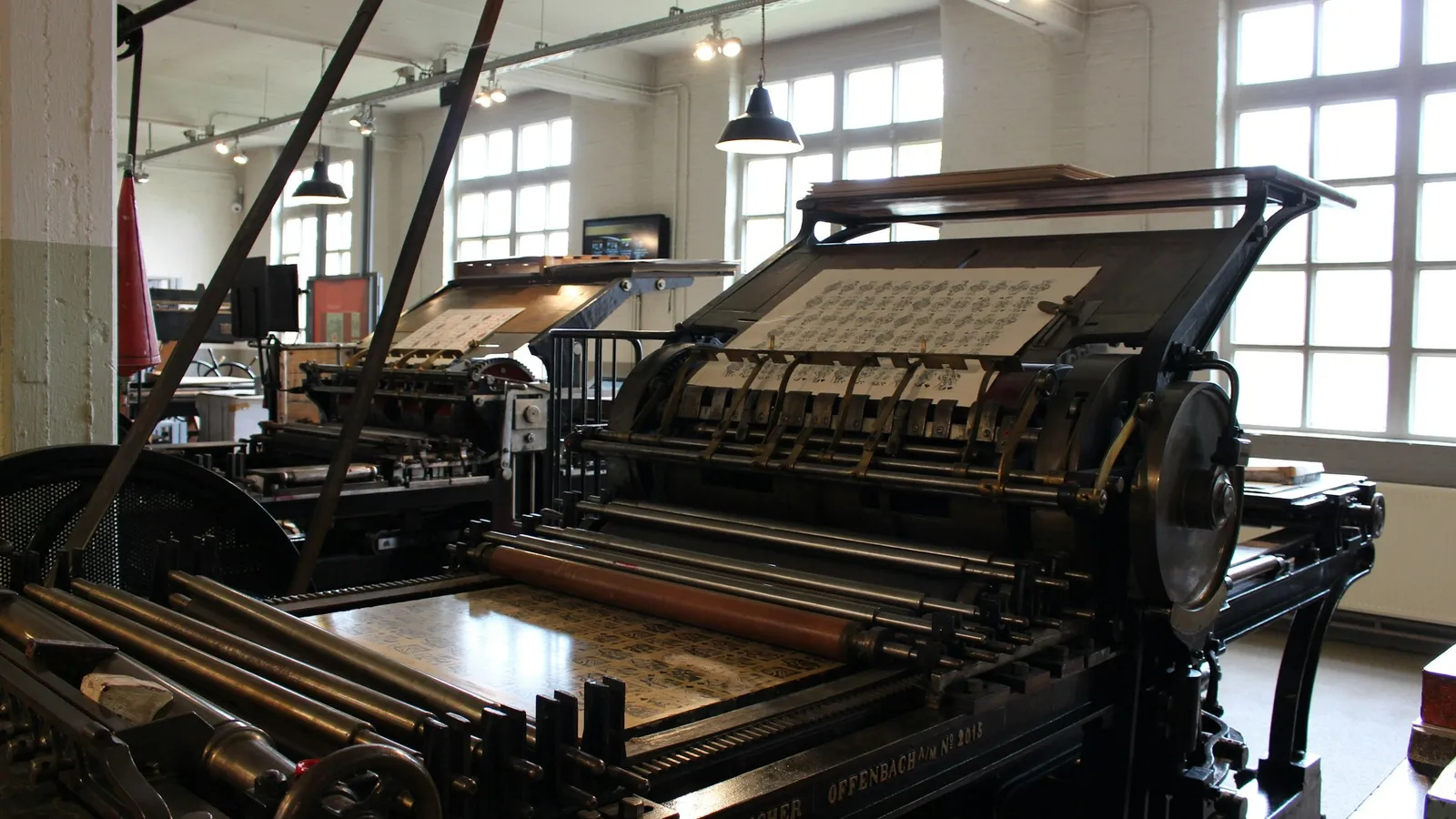 An old printing press in a bright workshop