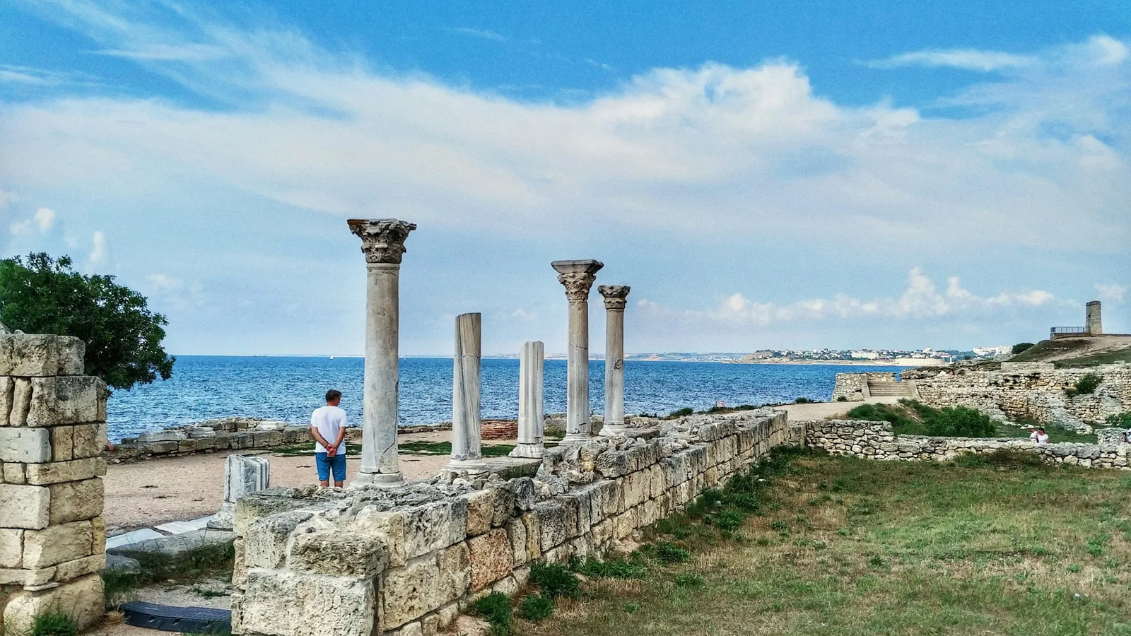 Ancient stone columns standing by the sea