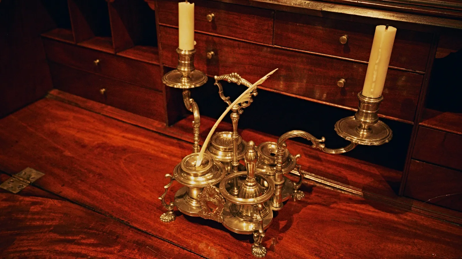 Antique brass scientific apparatus on a wooden desk