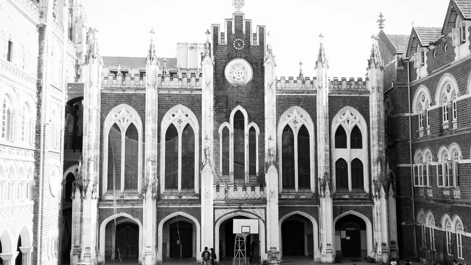 Black-and-white photo of the Gothic brick-and-stone facade of St. Xavier's College, Mumbai