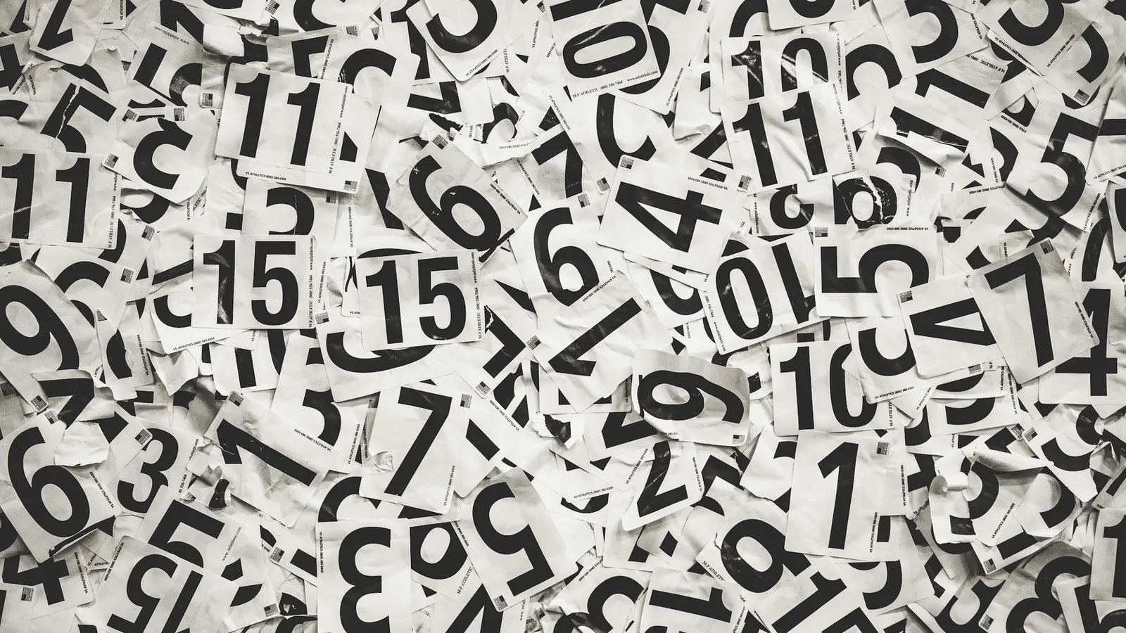 Black numbers printed all over a white surface