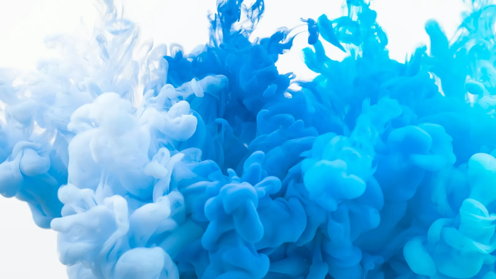 Blue colour spreading through water