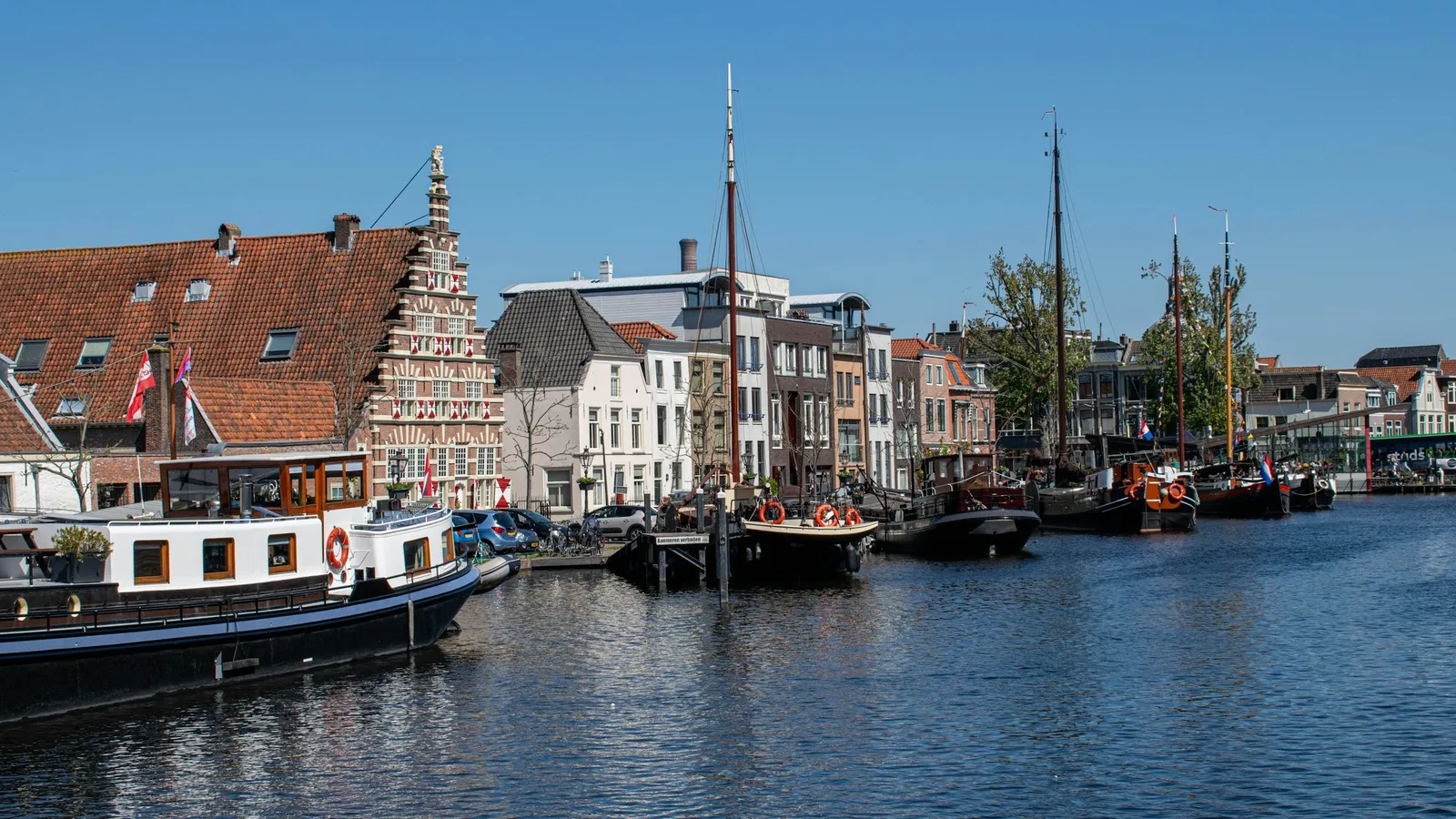 Boats moored along a canal in Leiden