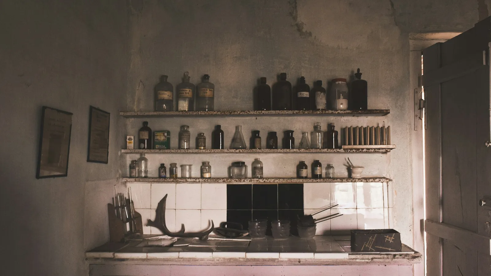 Bottles of chemicals on shelves in an old laboratory