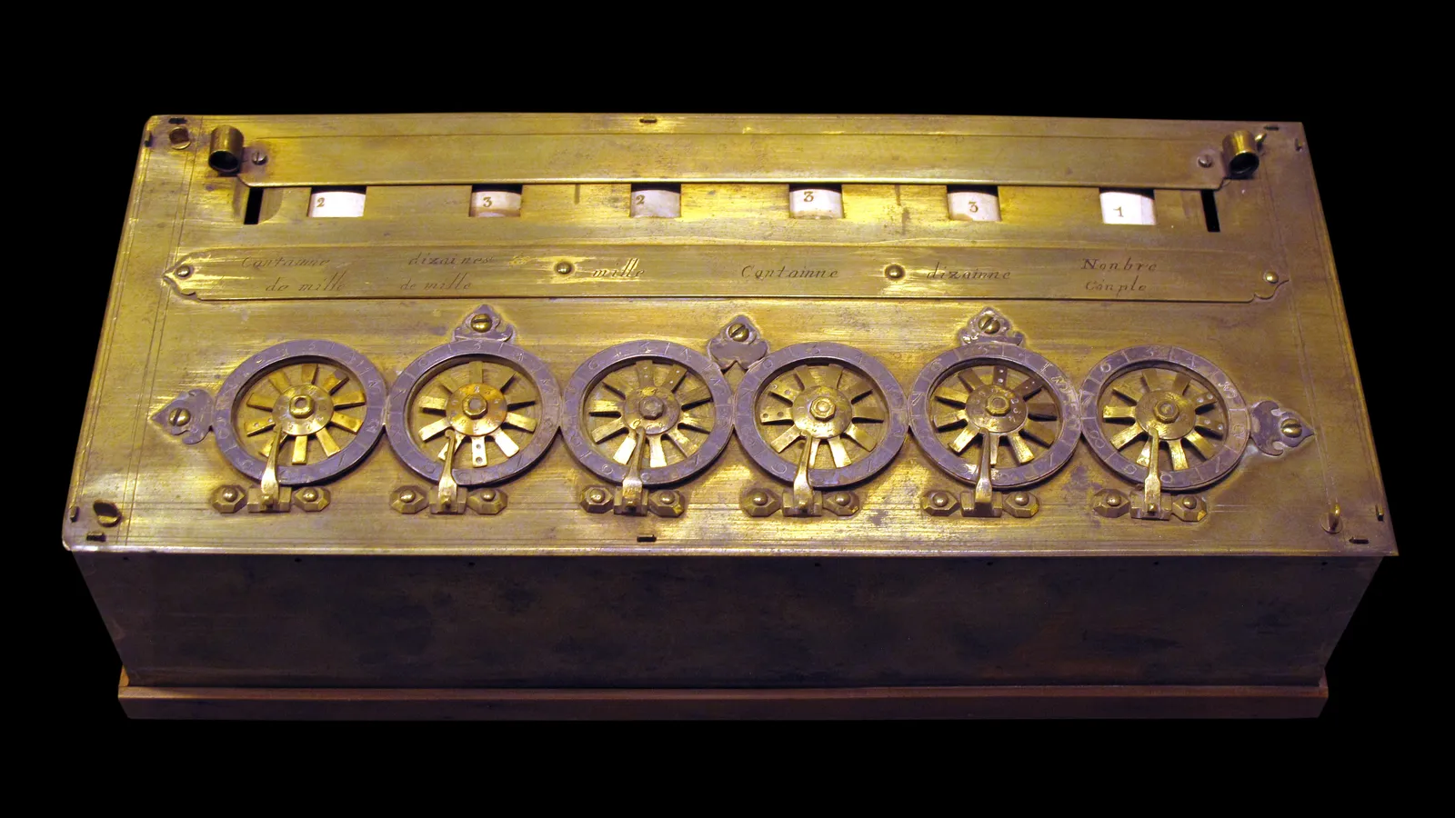 Brass Pascaline calculator with six spoked dials and number windows
