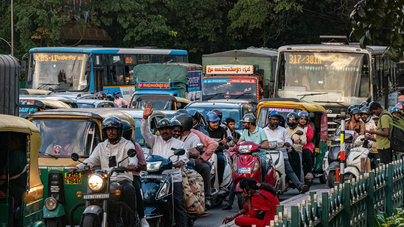 Busy traffic with autos and buses on a crowded street