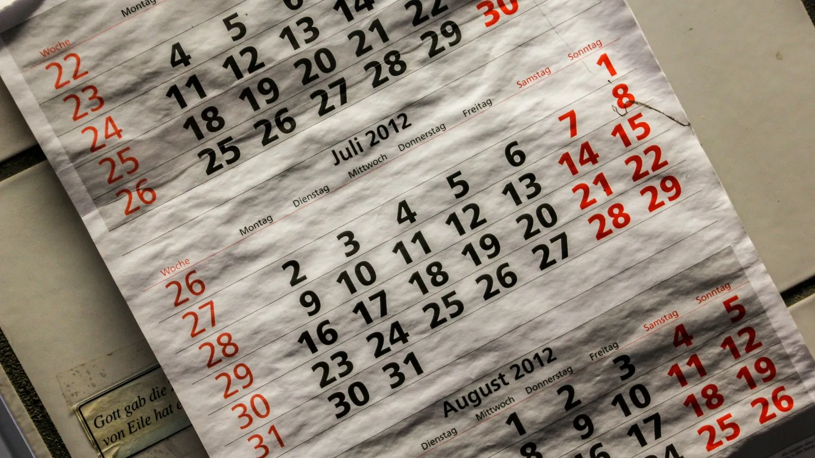 Calendar pages with dates marked in red