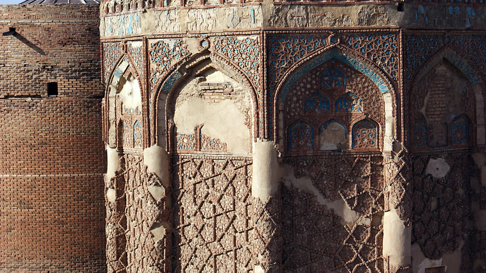 Carved brick arches on an old Persian tower