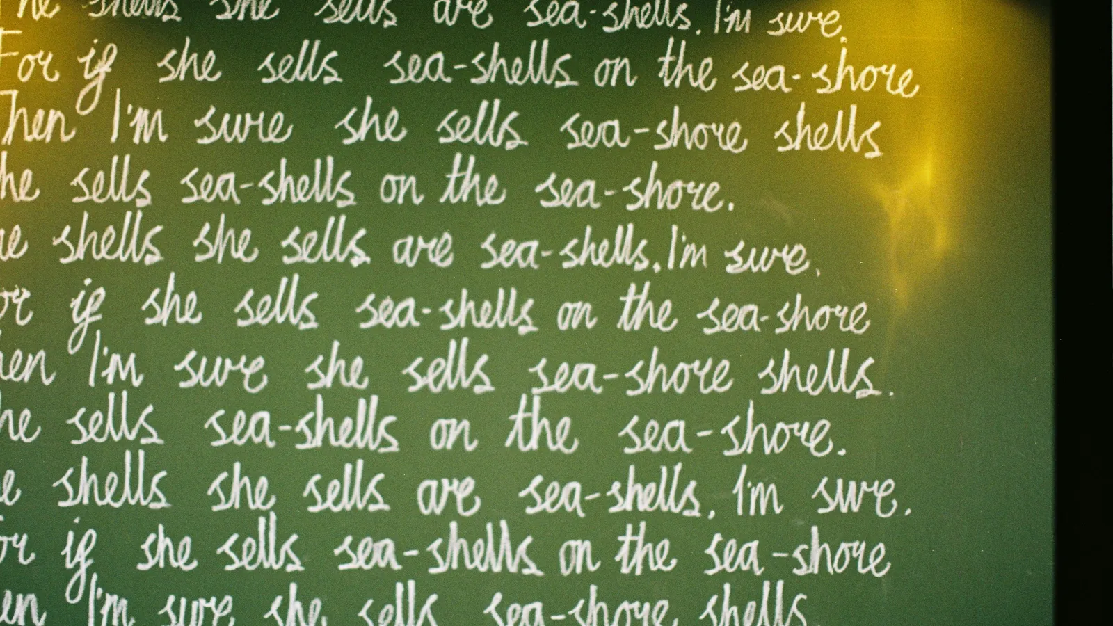 Chalkboard filled with the same line written over and over