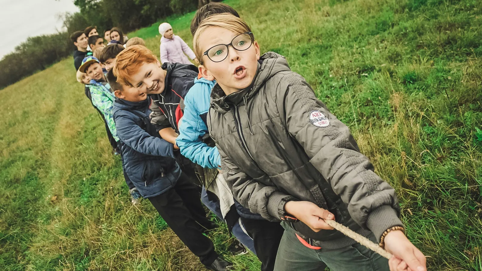 Children pulling on a rope in a tug of war